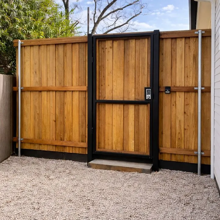 Steel-framed cedar walk gate with a keypad lock